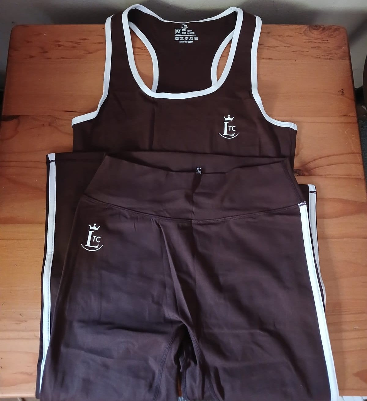 LTC Contrast Trim Legging Set flat lay — chocolate brown racerback tank and matching leggings with white trim